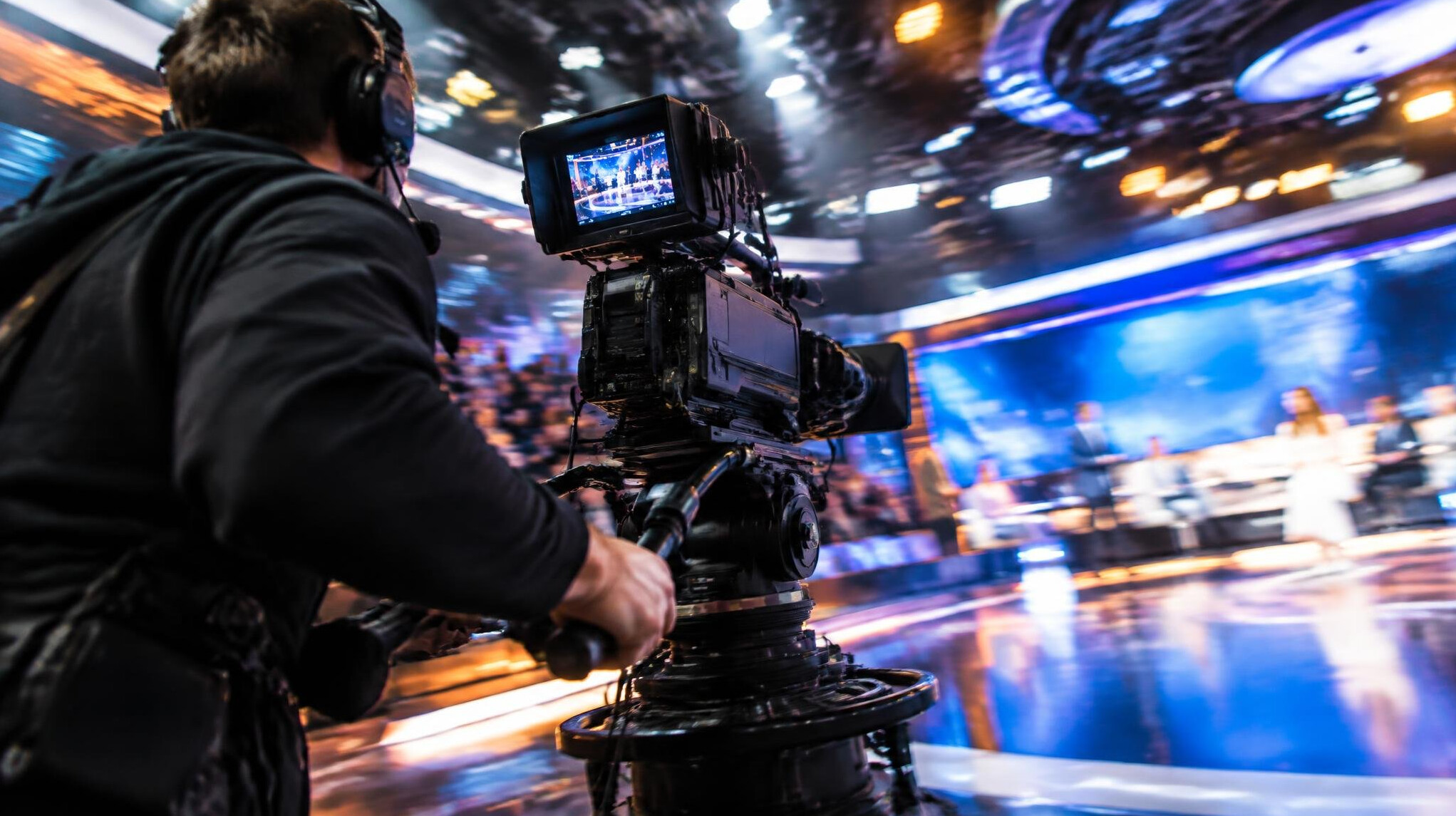 Camera operator panning during a live television broadcast